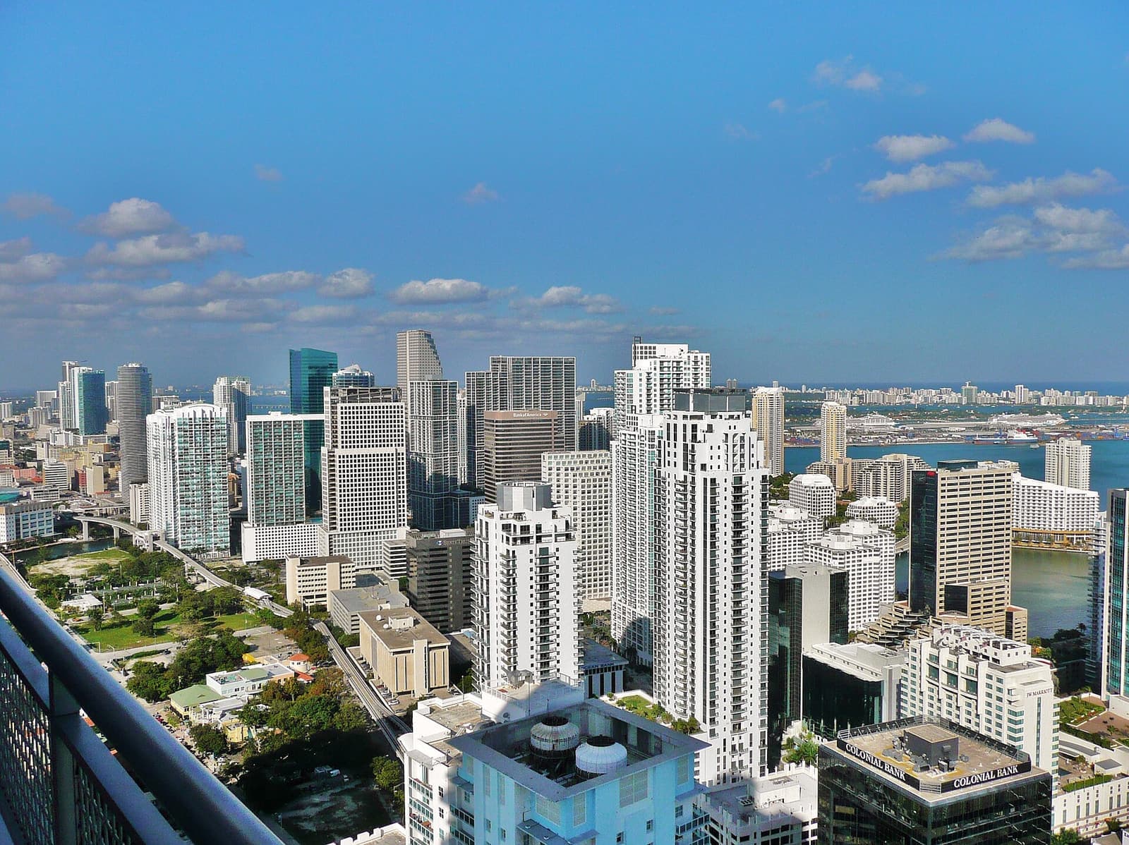 Miami skyline and waterfront under a bright blue sky