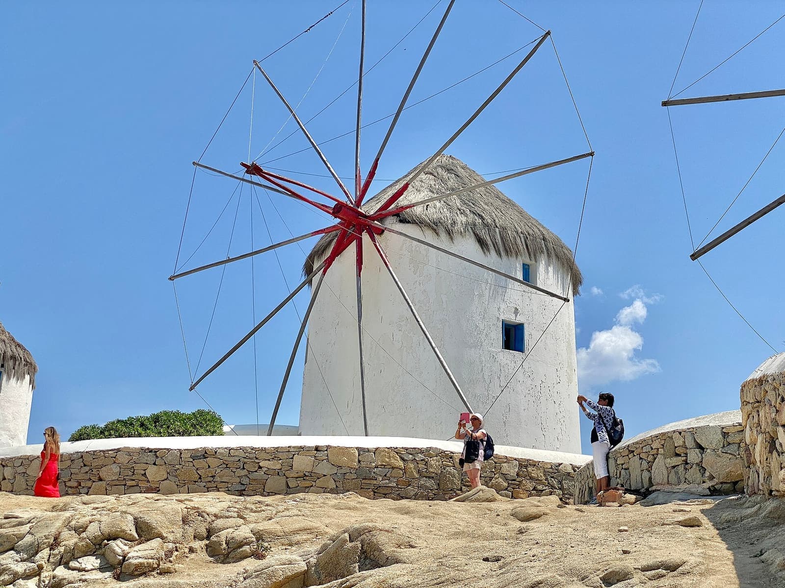 Traditional windmills above the whitewashed town of Mykonos