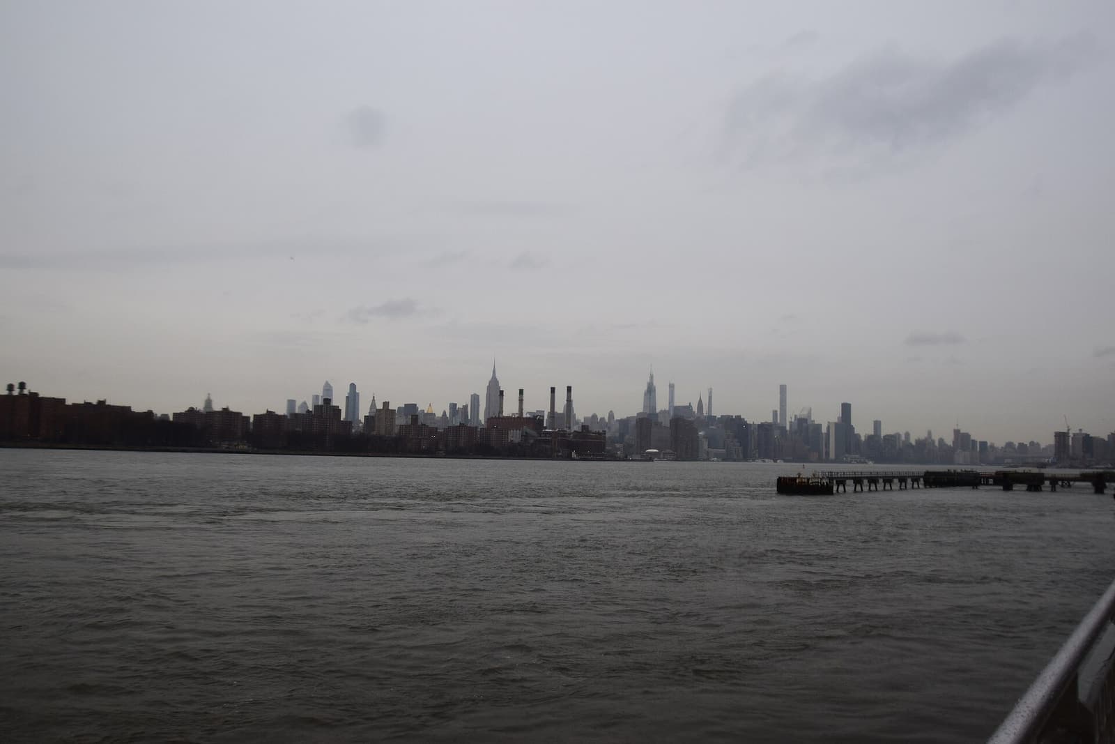 Manhattan skyline lit up at night seen across the river
