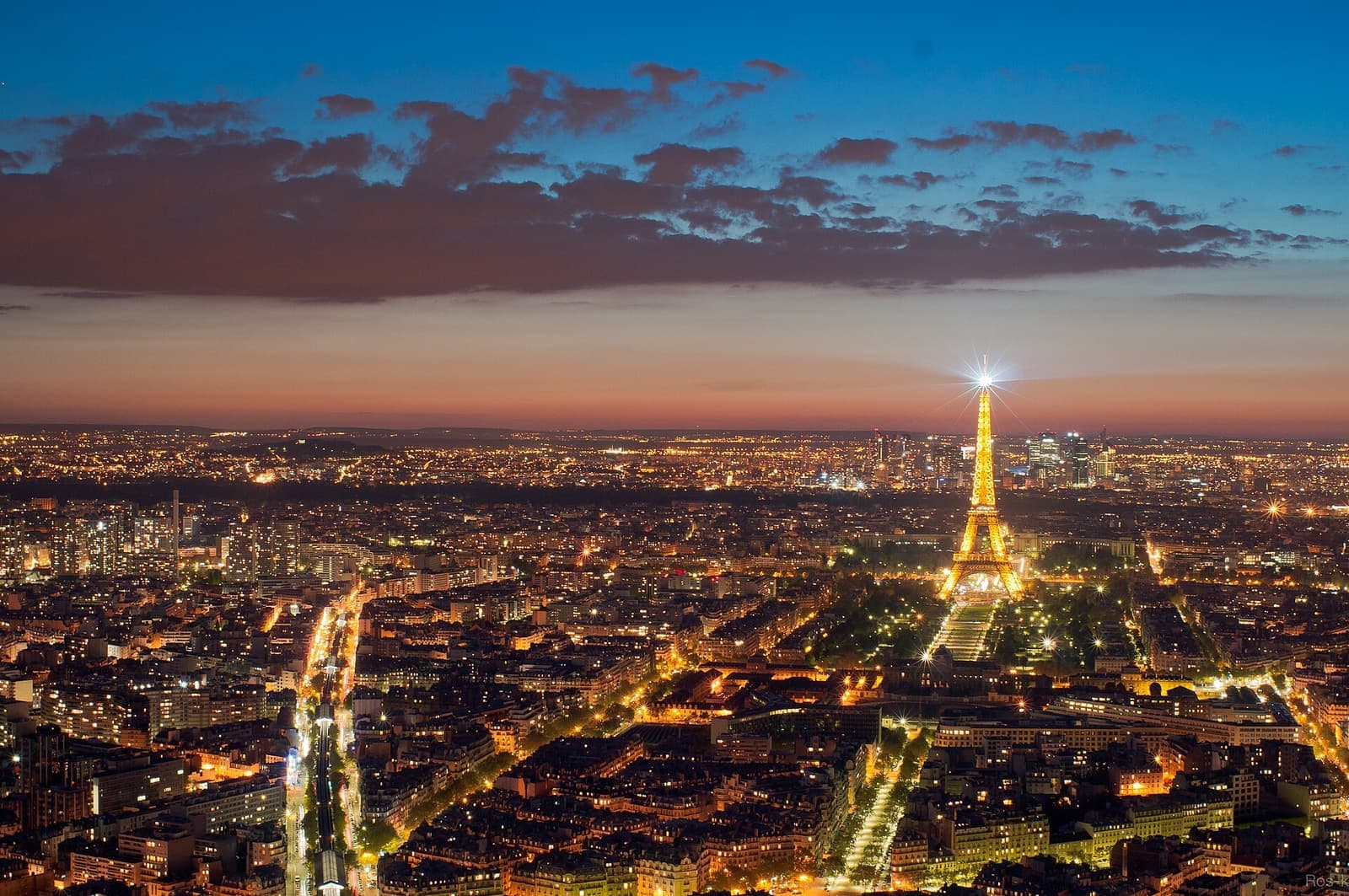 The Eiffel Tower above the Paris rooftops in evening light